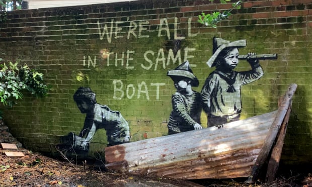 Street art that appeared on a wall in Nicholas Everitt Park, Lowestoft, Suffolk. The piece features one child looking ahead as though out to sea, another child behind looking over their shoulder, and a third child at the back of the boat appearing to be leaning over the side holding a bucket. It reads ‘We’re all in the same boat’