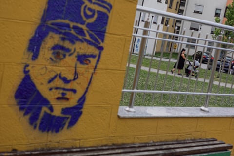 A stencilled image of the Bosnian Serb war criminal Ratko Mladić, on a wall near residential buildings in East Sarajevo.