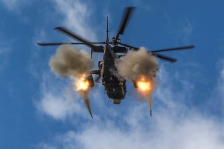 Russian Ka-52 helicopter gunship of the Russian air force fires rockets at a target at an unknown location in Ukraine.