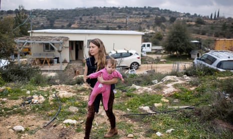 A woman and her baby in the settlement of Sde Boaz in the Gush Etzion block in the West Bank on 16 February 2023. Sde Boaz is one of the nine settlements to be legalised by the Israeli cabinet.