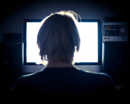 Man using his computer late into the night