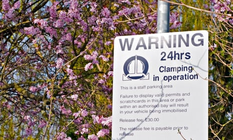 A typical hospital parking sign showing staff will be penalised if they don’t obey the rules.