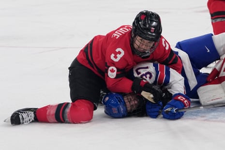 Canada's Jocelyne Larocque wrestles the USA’s Abbey Murphy during their group-stage game.