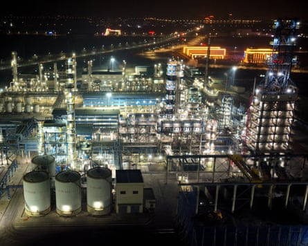 An oil refinery lit up at night.