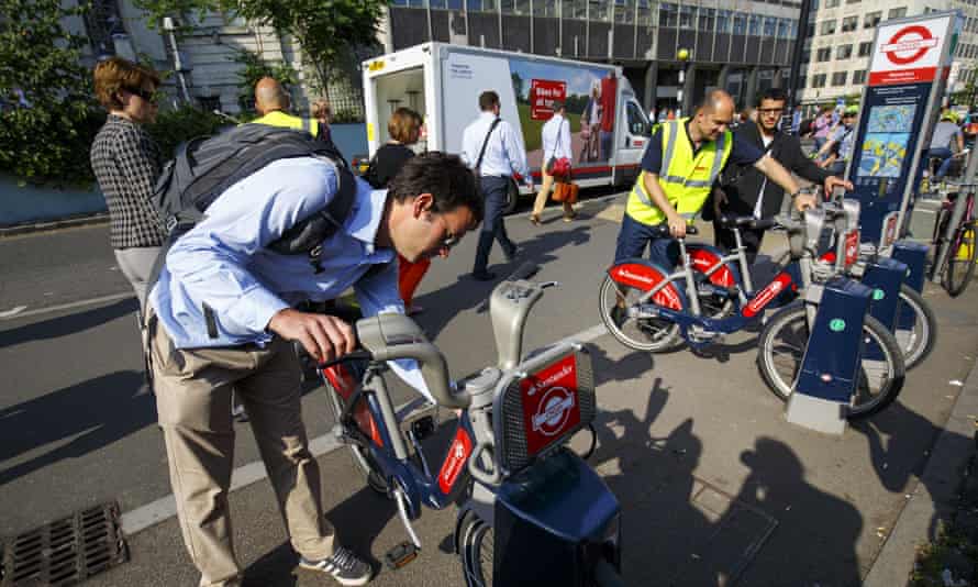 Commuters hiring Boris bikes outside Waterloo Station.