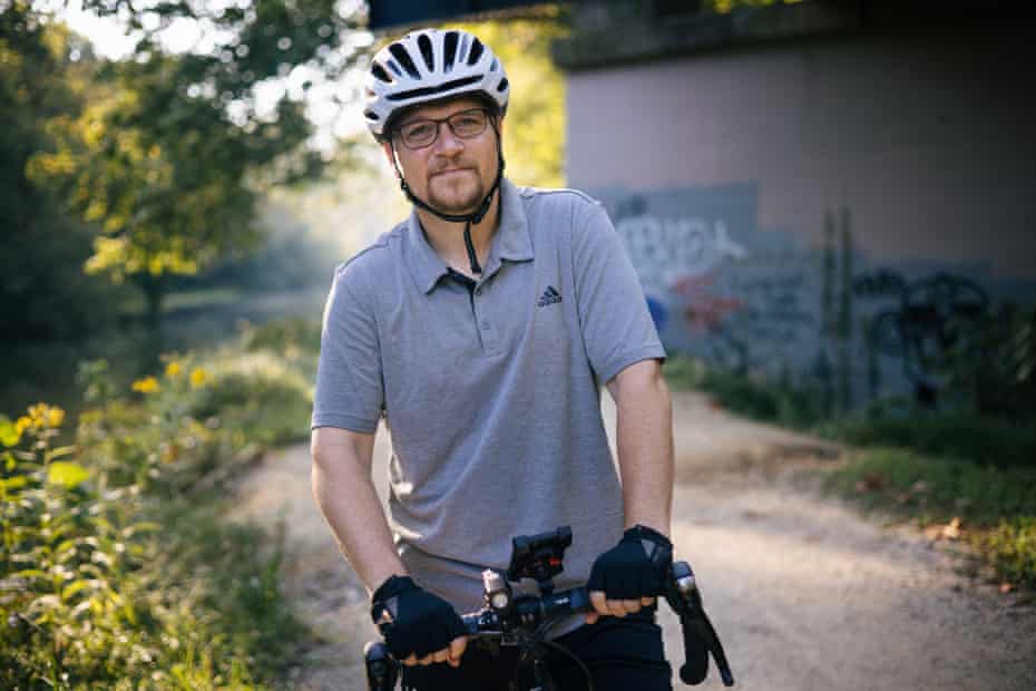 Goldberg poses for a portrait along his bicycle.