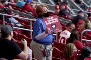 Holding sign at football game