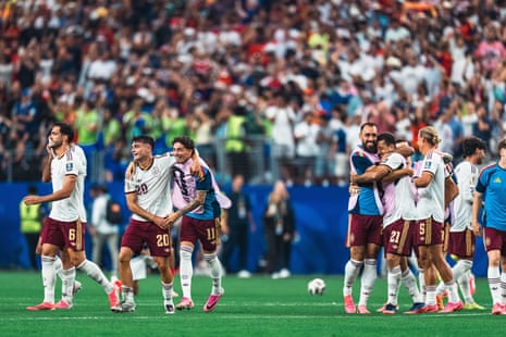 The Spanish national squad celebrate on picth