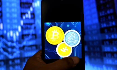 Illustration of the Bitcoin and Litecoin logos seen displayed on a smartphone