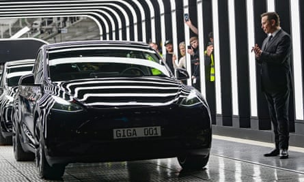 Elon Musk looks at Tesla cars at Tesla’s Gigafactory in Gruenheide, south-east of Berlin