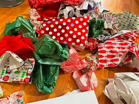 A stack of wrapping paper on the floor after opening presents on Christmas Day.