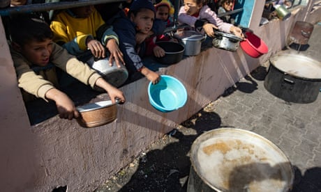 Displaced Palestinians queue to receive food at Rafah camp<br>epa11118487 Displaced Palestinians hold empty pots and buckets as they line up to receive food aid provided by a Palestinian youth group, at Rafah refugee camp, southern Gaza Strip, 01 February 2024. Since 07 October 2023, up to 1.9 million people, or more than 85 percent of the population, have been displaced throughout the Gaza Strip, some more than once, according to the United Nations Relief and Works Agency for Palestine Refugees in the Near East (UNRWA), which added that most civilians in Gaza are in 'desperate need of humanitarian assistance and protection'. EPA/HAITHAM IMAD