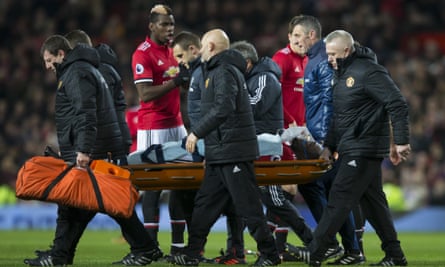 Romelu Lukaku is stretchered off in the first half after a clash of heads with Wesley Hoedt.