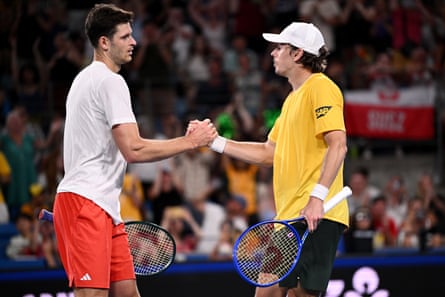 Alex de Minaur shakes hands with Hubert Hurkacz of Poland after winning their match in Sydney.