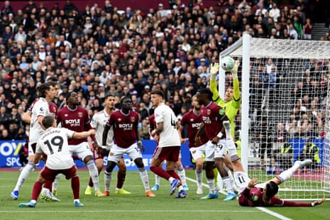 Mads Hermansen of West Ham saves a header from Leandro Trossard