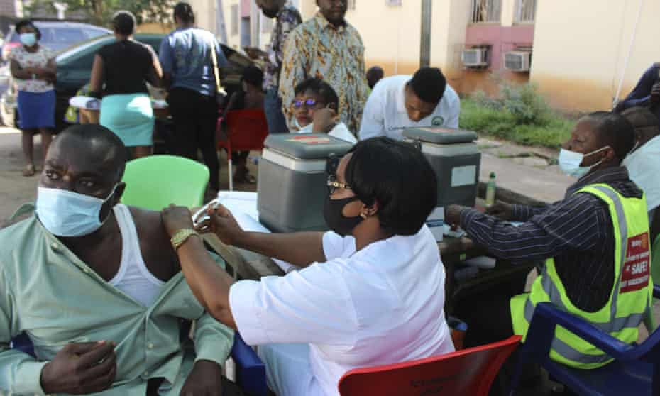 People receive the coronavirus vaccine in Abuja, Nigeria, November 2021. 