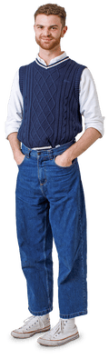 Ben in navy tank top, jeans and high-top trainers