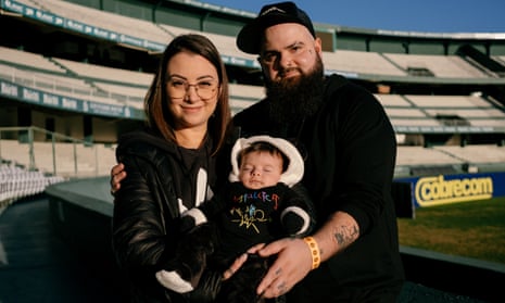 Joice and Jaime Figueiró with their baby Luan James at the stadium where he was born in Curitiba, Brazil.
