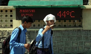 Indian schoolchildren eat ice cream as the country suffers a severe heatwave.