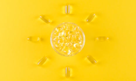 golden omega capsules like sun on yellow background