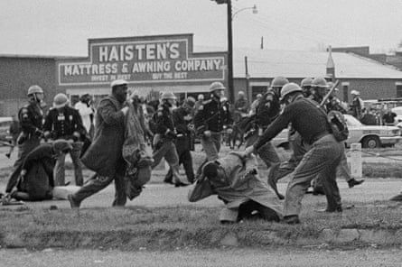 State troopers attack activists with billy clubs to break up a civil rights march in Selma on 7 March 1965. In the foreground, John Lewis is being beaten by a state trooper.
