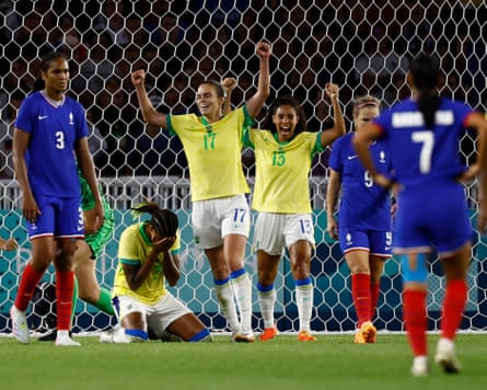 Brazil celebrate their Olympic defeat of the hosts France.