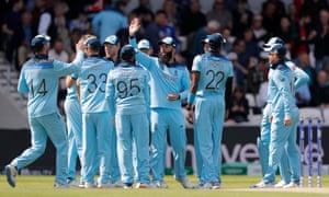England's Moeen Ali congratulates his teammates after taking a horse to fire Kusal Perera.