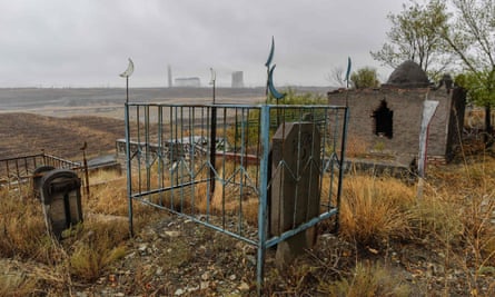 A large Muslim cemetery on the outskirts of Urumqi, the regional capital of Xinjiang. China is destroying burial grounds where generations of Uighur families have been laid to rest.