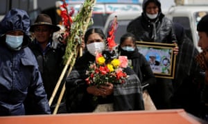 Mourners at a funeral in Bolivia: ‘This is worse than the financial crisis of 2008 and for Latin America worse than the debt crisis of the 1980s.’