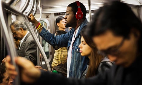people riding new york subway