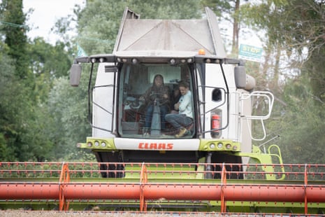 Kemi Badenoch driving a combine harvester during her visit to Hall Farm in Little Walden, Essex.