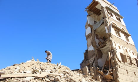 Boy walks on the rubble of a house destroyed by a recent Saudi-led air strike in the northwestern city of Saada, Yemen