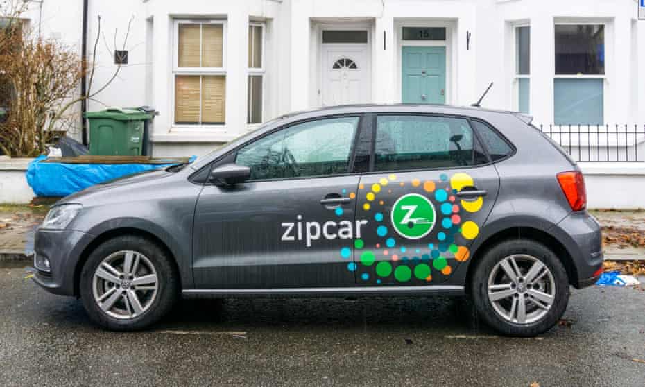 A VW Golf Zipcar in the rain in south London