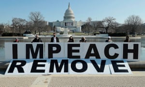 People gather at the base of the US Capitol with large letters on Tuesday in Washington DC.