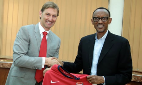 Former Arsenal player Tony Adams with President Paul Kagame
