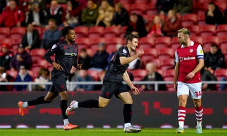 Lincoln City's Matty Virtue (centre) celebrates after opening the scoring with a fine strike.