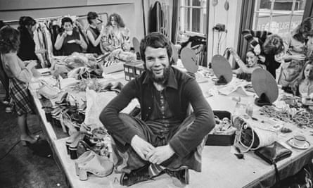 Bill Gibb in his studio surrounded by models