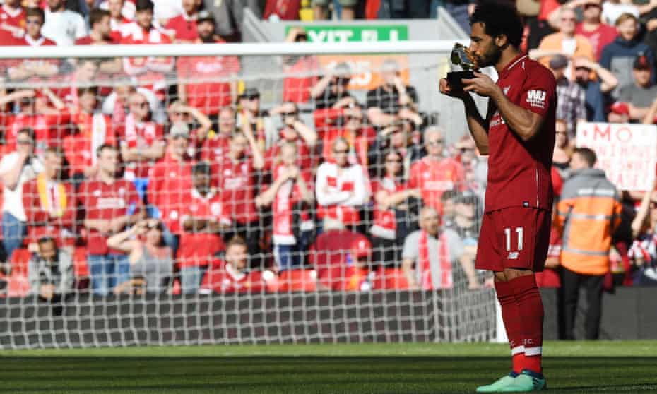 Mohamed Salah celebrates after being awarded the golden boot award.