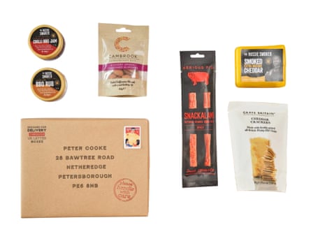 Barbecue hamper contents including cheese, crackers, salami and almonds