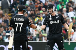 Neesham congratulated by De Grandhomme for reaching his half century.