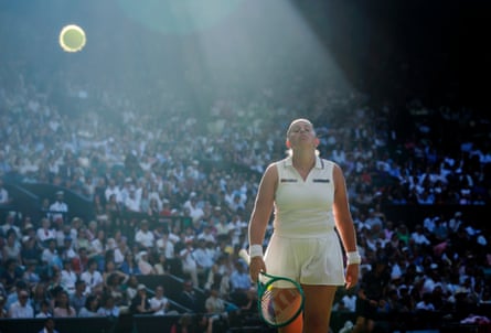 A ball bounces high while Jelena Ostapenko looks on