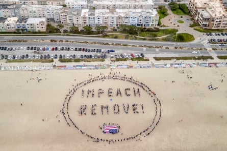 People forming circle with words Impeach and Remove, with upside down flag.