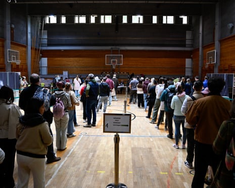 People queue up at a polling station during the Hungarian parliamentary election in Budapest, Hungary.