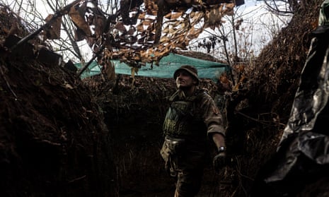 Ukrainian soldier is seen in his combat position in a trench in Niu York, Ukraine.