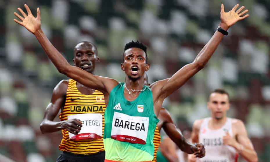 Selemon Barega celebrates winning the first gold in the athletics with victory in the 10,000m
