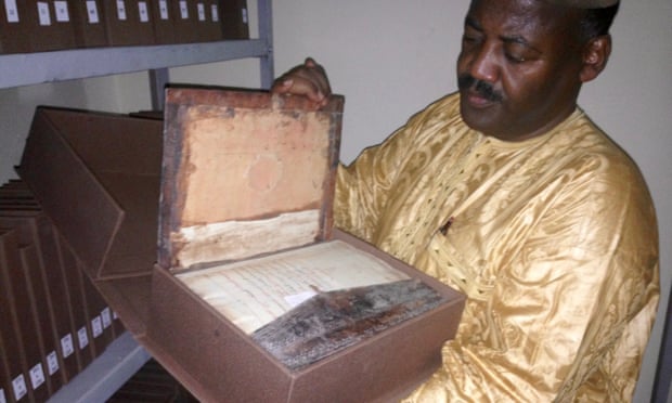 Abdel Kader Haidara showing rescued manuscripts in Bamako in 2015.