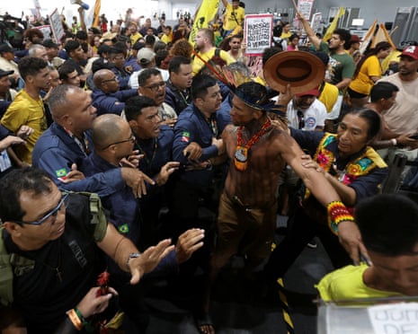 Demonstrators force their way into the Cop30 venue in Belem on Tuesday evening