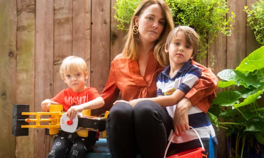 Elle Cavatore poses her boys, Thomas, left, and Patrick at their home in Houston, Texas.