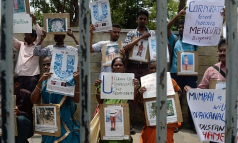 Indian activists hold placards during a protest outside the Hindustan Unilever company’s office in Mumbai, in June 2015