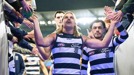 Bailey Smith acknowledges the fans after Geelong defeat Essendon